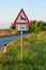 Deer Warning Sign on Country Road. Wild animals warning road sign. Deer crossing sign