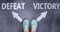 Defeat and victory as different choices in life - pictured as words Defeat, victory on a road to symbolize making decision and