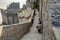 The defensive walls of Mont Saint Michele, having a broad top with a walkway and typically a stone parapet. Normandy