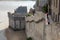 The defensive walls of Mont Saint Michele, having a broad top with a walkway and typically a stone parapet. Normandy, France