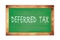 DEFERRED  TAX text written on green school board