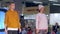 Defile, male and female models in sportswear walk at podium during a fashion show in spotlight