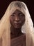 Defining beauty. Studio portrait of an attractive young woman posing in traditional African attire against a black