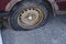 Deflated damaged tyre on car wheel.