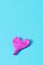 Deflated pink heart-shaped balloon