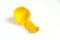Deflated yellow balloon isolated on a white background