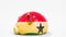 Deflating inflatable piggy bank with printed flag of Ghana. Financial crisis related conceptual 3D rendering