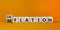 Deflation or reflation symbol. Turned cubes and changed the word deflation to reflation. Beautiful orange background, copy space.