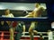 Defocus background of two aggressive Thai boxing fighters / boxers are fighting in the middle of the ring