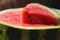 Defocus bright watermelon. Close-up of fresh slice red watermelon. Slices of water melon. Ukraine, Kherson. Out of focus