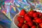 Defocus close-up cropped bowl of ripe red strawberries on modern hologram background. Fruits and berries. Harvest and