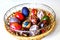 DEFOCUS Colorful Easter eggs. Round basket with easter eggs on white background. Easter decoration with crafted nest. Perfect