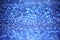 defocus of glitter lights background. blue,white and black for Christmas and new year background.