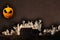 Defocus Halloween concept. Mysterious abandoned house at cartoon star dark sky. Pumpkin Jack lantern instead of the moon
