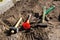 Defocus hammer, mallet, chisel and bayonet of the shovel lie on the ground. Set of tools for laying paving stones. Working process