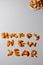 Defocus happy new year word on gray background. Written text using orange and tangerine skins. Good New Year spirit