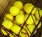 Defocus image of Close up view of balls in basket on clay tennis court.