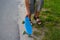 Defocus Little boy holding a penny skateboard. Young kid riding in the park on a skateboard. Child learns to ride a blue