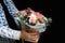 Defocus Man flowers. Close up of box with pink roses in male hands. Male give bouquet for mother\'s day, valentines,