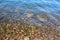 Defocus Natural abstract background of sea pebbles water .