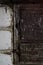 Defocus Old stove doors. Iron door close-up detailed decor in antique house. Vertical. Dirty brick. Out of focus