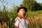 Defocus outdoor portrait of a beautiful blonde middle-aged woman near reed and pampas grass. Youth, wellness and
