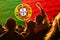 Defocus Portugal football team. supporters on stadium. Portugal flag and football fans celebrating victory. Protest in