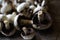 Defocus raw mushrooms champignons on black background, cooking fresh champignons. Fresh whole white button mushrooms, or