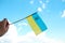 Defocus Ukraine flag. Large national symbol fluttering in blue sky. Support and help Ukraine, Independence Constitution