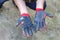 Defocus worn dirty and leaky gloves. Open palms of hands in worn workers gloves, protection against damage during