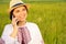 Defocus young ukrainian woman portrait. Meadow nature background. Smiling ukrainian girl talking phone. Mental health