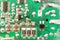 Defocused abstract background of green circuit board with microcircuits