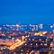 defocused abstract city lights in the twilight with river, reflection and horizon, bokeh background, closeup