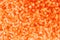 Defocused of abstrct orange glitter bokeh with close up