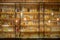 Defocused background of bar counter with various bottles of alcohol