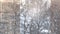 Defocused background of high-rise buildings, trees and falling snow