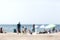 Defocused beach, sea and people with free space for text