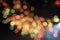 Defocused of beautiful  polygon lights..Bokeh of multi colorful light  in 7 polygon heptagon in smoky night background