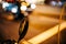 Defocused blur view of motorcycle moped rear view mirror with defocused blurred