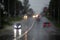defocused cars on road at summer heavy rain