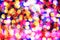 Defocused christmas colorful lights background. Festive abstract backdrop. Xmas, New year, Carnival and holidays concept