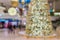 Defocused christmas tree in shopping center bokeh background
