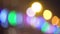 Defocused colorful festive lights on dark background