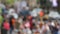 Defocused crowd of people, road intersection crosswalk on The Strip of Las Vegas, USA. Anonymous blurred pedestrians on walkway in