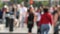 Defocused crowd of people, road intersection crosswalk on The Strip of Las Vegas, USA. Anonymous blurred pedestrians on walkway in