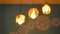 Defocused decorative light bulbs hanging on the ceiling