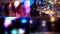 Defocused disco. Festive lights, colored lights and dancing people