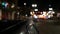 Defocused evening street. Lights of city, cars on rainy night. Road in soft focus. Twilight in USA.