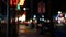 Defocused evening street. Lights of city, cars on rainy night. Road in soft focus. Twilight in USA.