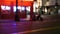 Defocused evening street. Lights of city, cars on rainy night. Road in soft focus. Twilight in USA.